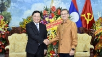 Phó Thủ tướng Phạm Bình Minh chúc Tết Bunpimay Đại sứ quán Lào tại Hà Nội
