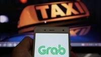 Grab bắt buộc phải trả nợ thuế thay Uber?